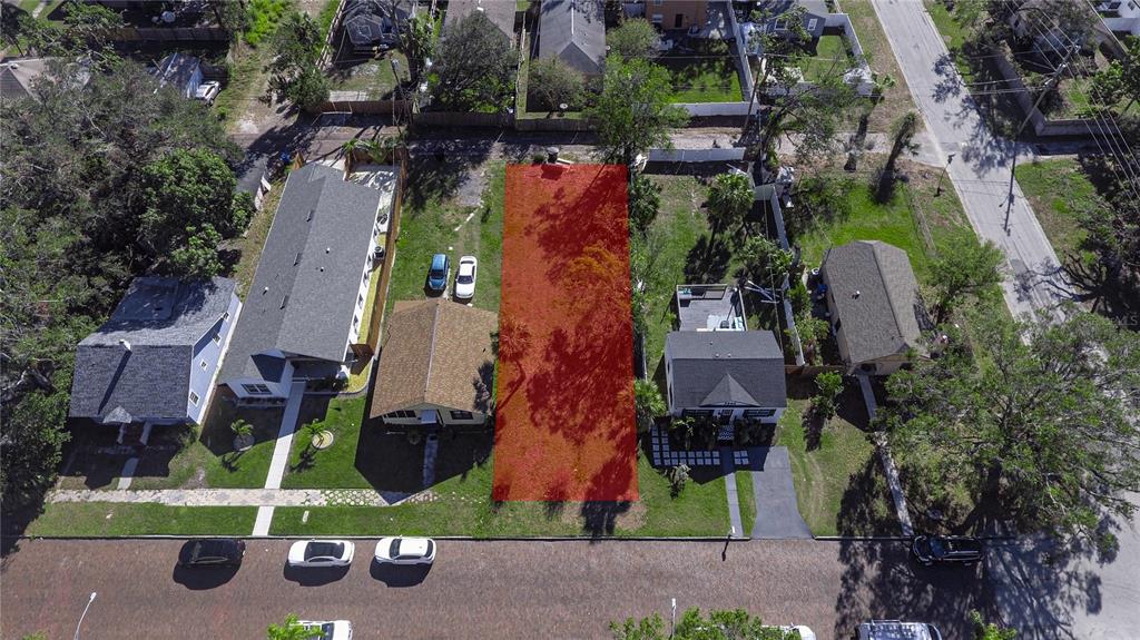 An aerial view shows a vacant, rectangular lot highlighted in red between two residential houses — 3530 2ND AVENUE S, ST PETERSBURG, FL