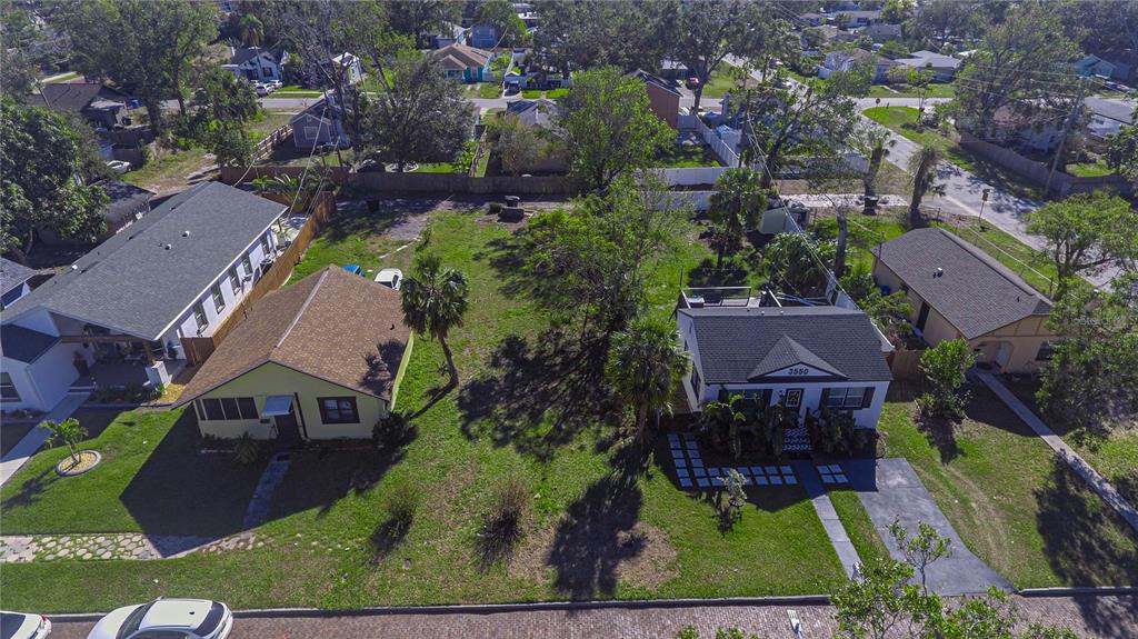 An aerial view shows two houses separated by a large, grassy yard with trees — 3530 2ND AVENUE S, ST PETERSBURG, FL
