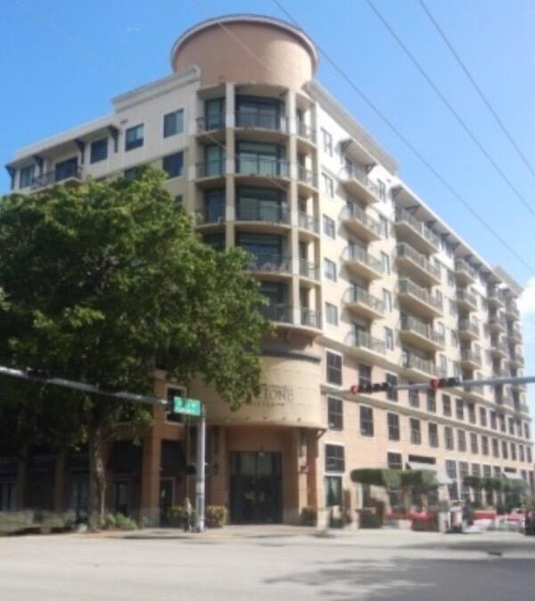 A multi-story apartment building with a curved corner facade and balconies on a sunny day — 3590 Coral Way # 502, Miami FL 33145, MIAMI, FL