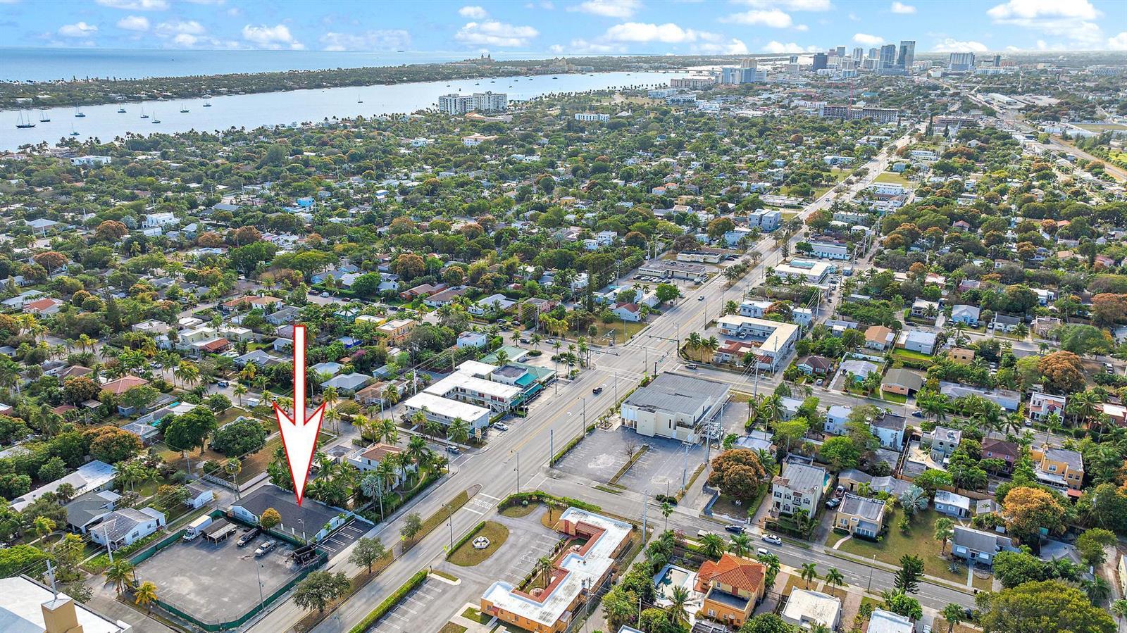 An aerial view shows a commercial building with a parking lot in a suburban neighborhood — 3808 Broadway # 3, West Palm Beach FL 33407, WEST PALM BEACH, FL