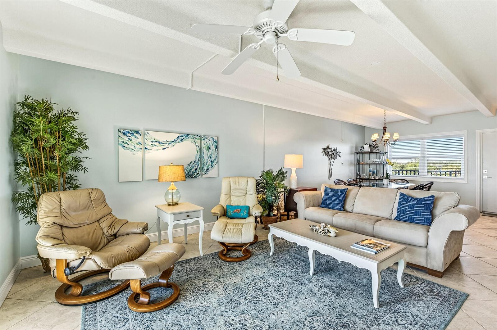 A living room features a beige sofa, two leather recliners, and a patterned area rug — 4410 Highway A1a # 307, Vero Beach FL 32963, VERO BEACH, FL