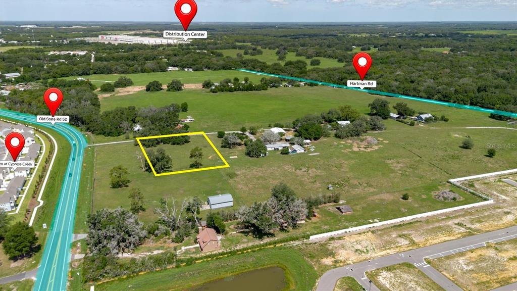 This aerial view shows a rural property with a highlighted rectangular plot of land — 31619 COUNTY ROAD 52, SAN ANTONIO, FL