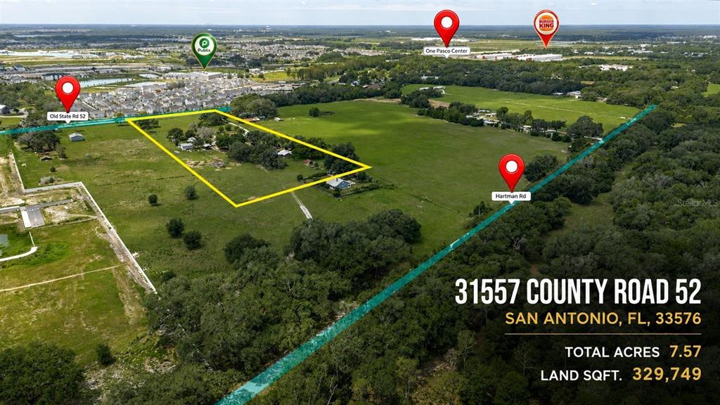 This is an aerial map view of a large, grassy plot of land in Florida — 31619 COUNTY ROAD 52, SAN ANTONIO, FL