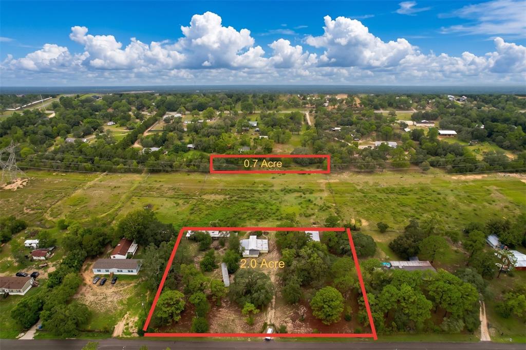 An aerial view shows two adjacent plots of land marked as 0.7 and 2.0 acres — 11189 SALOME STREET, BROOKSVILLE, FL