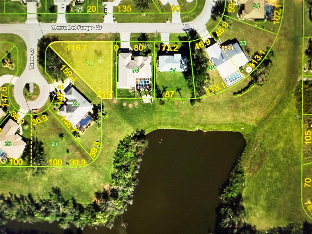 This is a property map showing residential lots and a pond in a neighborhood — 27374 TIERRA DEL FUEGO CIRCLE, PUNTA GORDA, FL