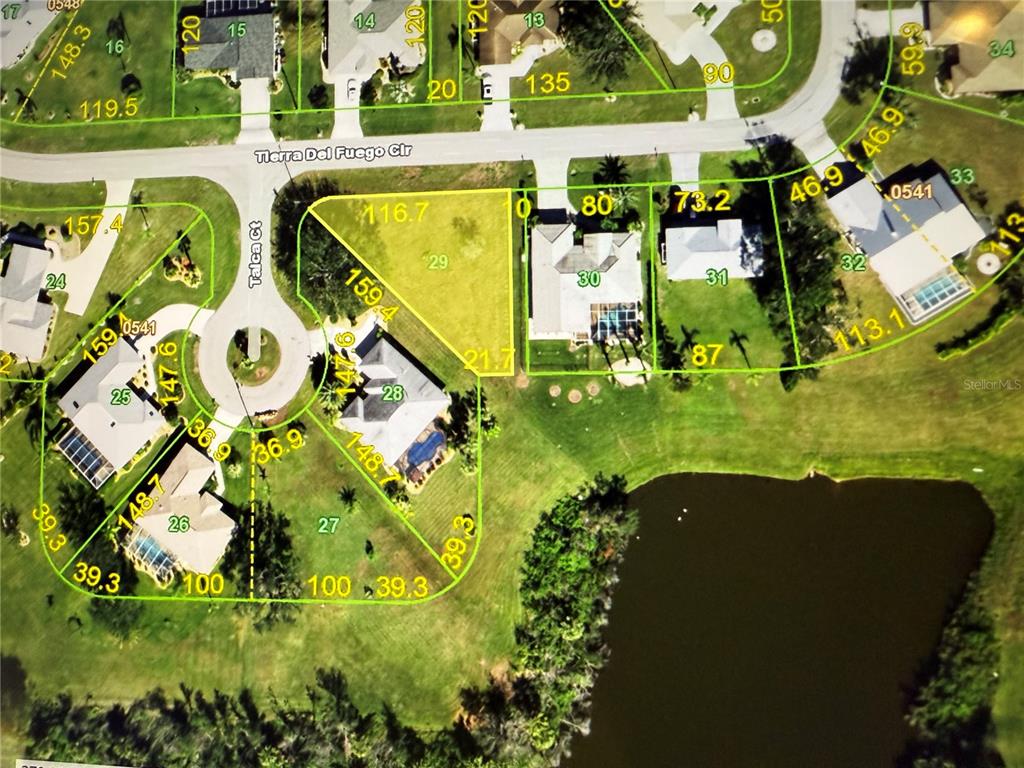 This is an aerial map showing property lot lines and parcel numbers for a neighborhood — 27374 TIERRA DEL FUEGO CIRCLE, PUNTA GORDA, FL