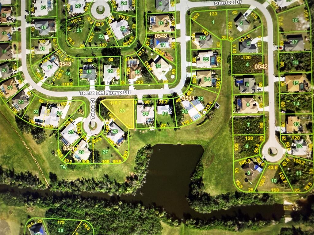This is a satellite map showing residential lots, streets, and a pond — 27374 TIERRA DEL FUEGO CIRCLE, PUNTA GORDA, FL