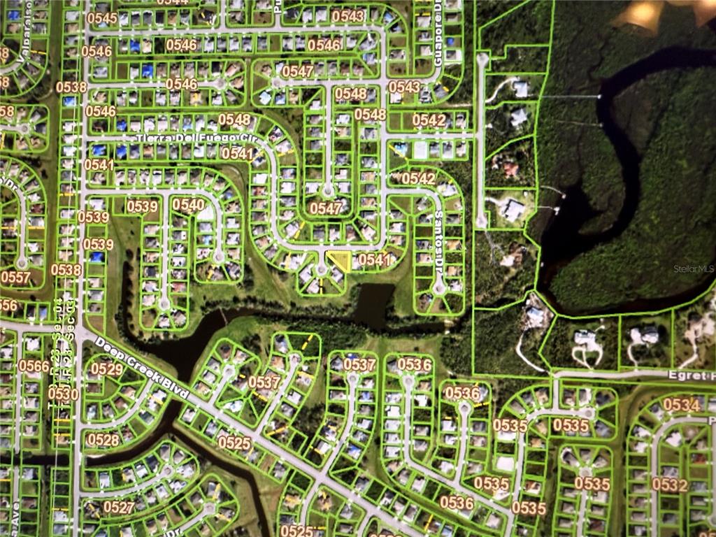 This is an aerial map showing residential lots and streets in a suburban neighborhood — 27374 TIERRA DEL FUEGO CIRCLE, PUNTA GORDA, FL