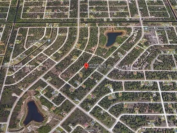 This is an aerial map view of a residential area with a red location pin — 343 Nathan Ave, Lehigh Acres FL 33974, LEHIGH ACRES, FL