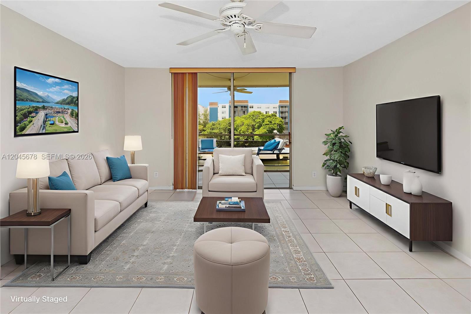 This living room features a beige sofa, a television, a ceiling fan, and a balcony — 505 E Dania Beach Blvd # 3G, Dania Beach FL 33004, DANIA BEACH, FL