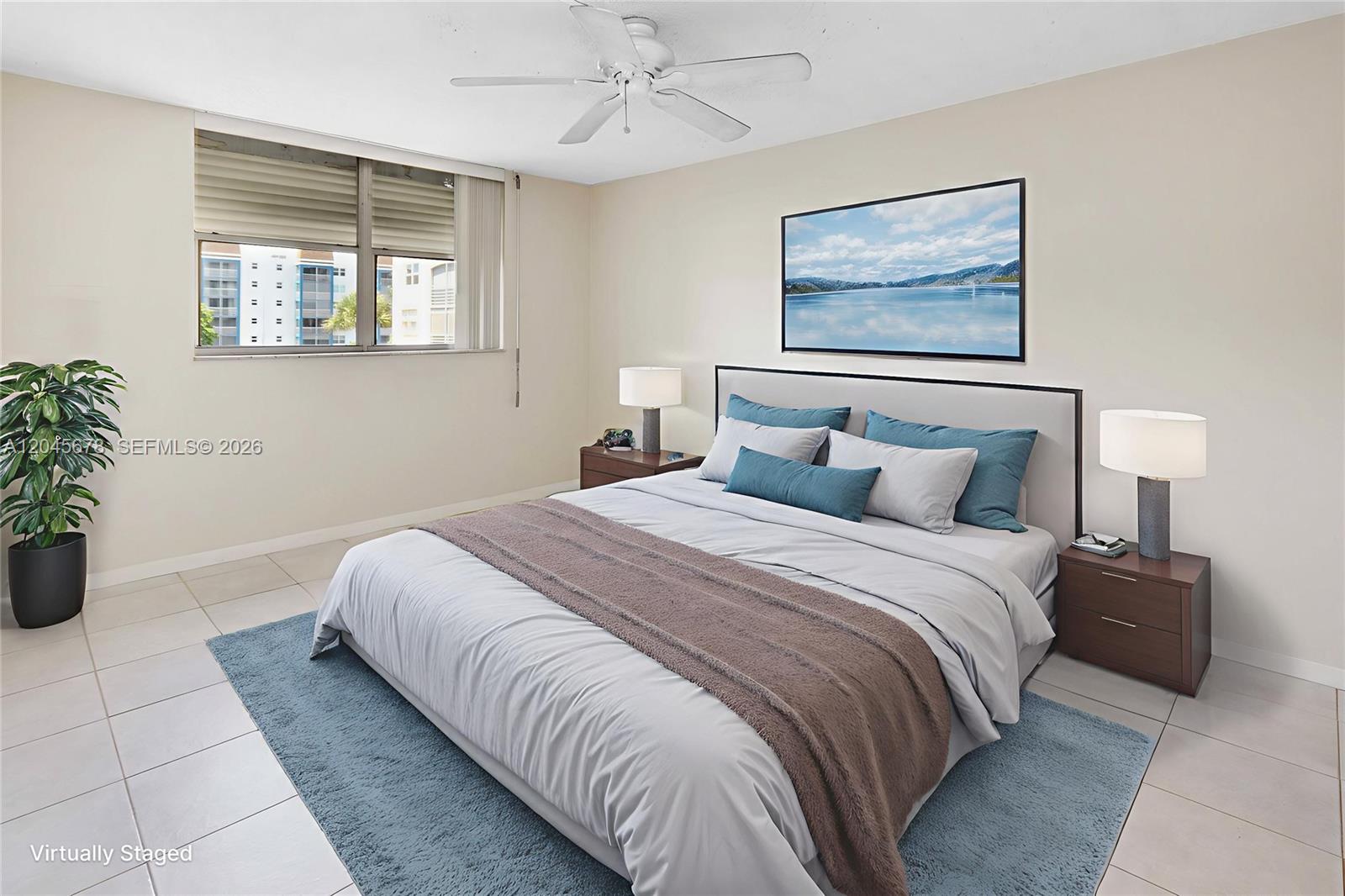 This virtually staged bedroom features a bed, two nightstands, a ceiling fan, and tile flooring — 505 E Dania Beach Blvd # 3G, Dania Beach FL 33004, DANIA BEACH, FL