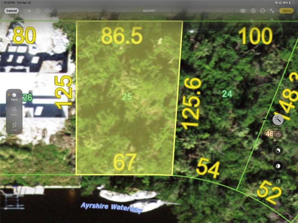 This is a map showing the property boundaries and dimensions of a waterfront lot — 18858 ASHCROFT CIRCLE, PORT CHARLOTTE, FL