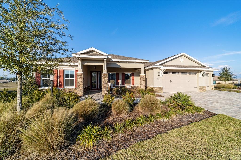A screened-in patio features outdoor furniture, a dining area, and a ceiling fan — 10453 SW 99TH LANE, OCALA, FL
