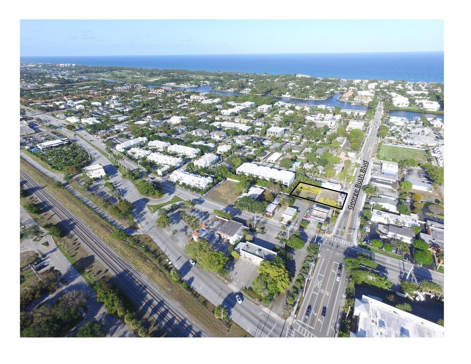 An aerial view shows a rectangular plot of land for sale along a city street — 655 S George Bush Boulevard, Delray Beach FL 33483, DELRAY BEACH, FL