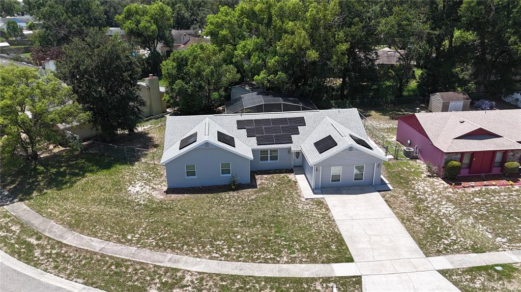 An aerial view of a single-story house with solar panels on the roof — 6120 CENTENNIAL DRIVE, ORLANDO, FL