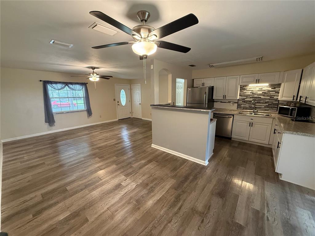 A single-story brick house with a front porch and an attached garage — 5515 NW 27TH TERRACE, GAINESVILLE, FL