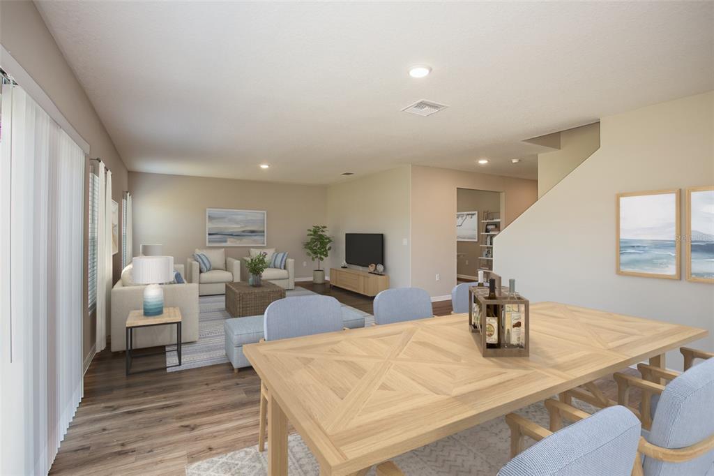 This is a digital rendering of an open-concept living and dining area with wood flooring — 36690 THORNHEDGE DRIVE, ZEPHYRHILLS, FL