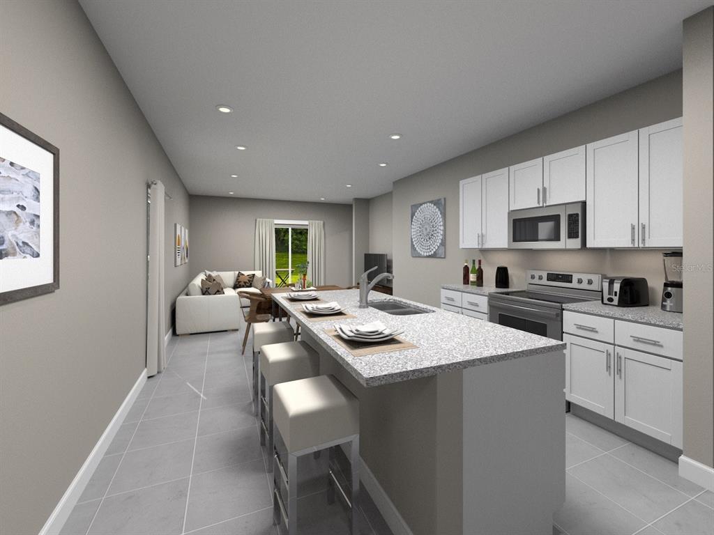 This is a digital rendering of a modern kitchen with white cabinets and a center island — 642 PENNYWORT STREET, LAKE ALFRED, FL