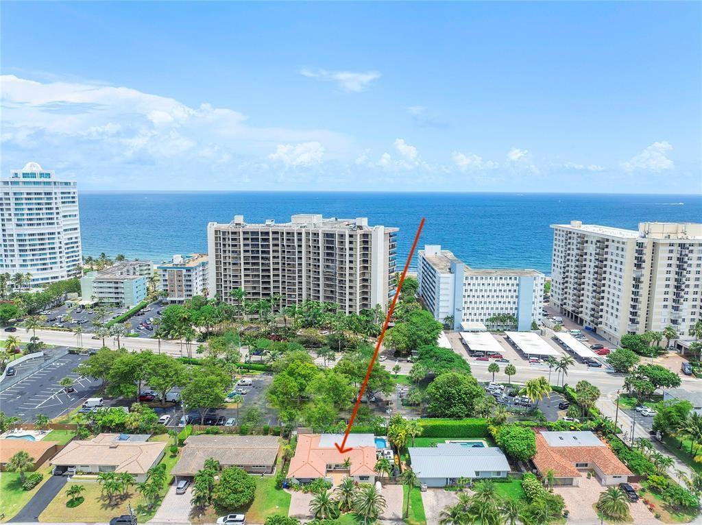 An aerial view shows a single-story house with a red-tiled roof near the ocean — 1820 Bel Air Avenue, Pompano Beach FL 33062, POMPANO BEACH, FL