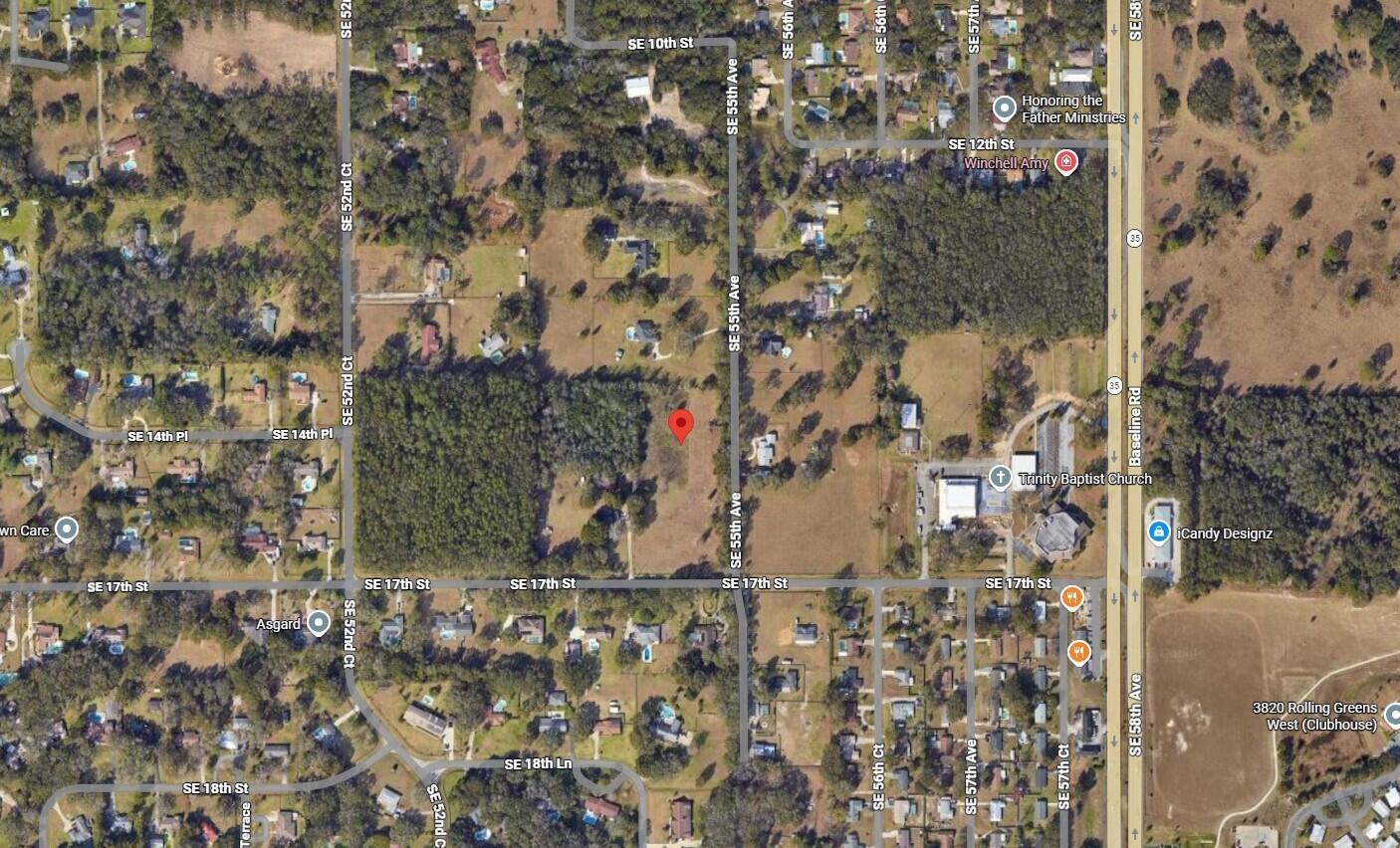 This is an aerial map view of a residential area with a red location marker — 1590 SE 55th Avenue, Ocala FL 34480, OCALA, FL