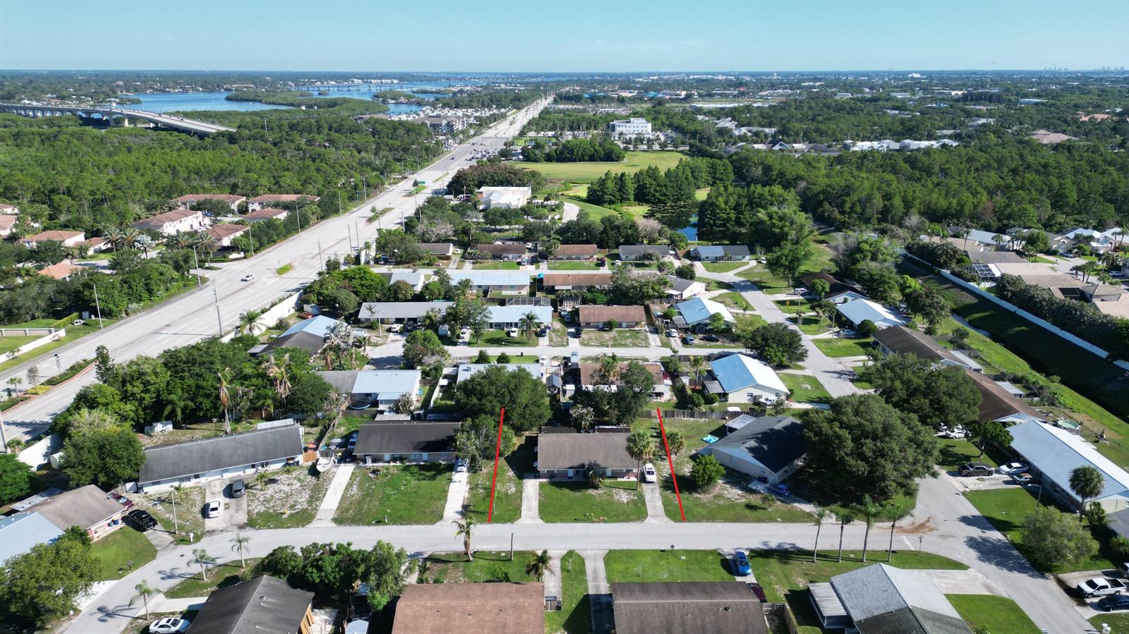 An aerial view shows a residential street with a highlighted single-story duplex property — 85 & 95 SE Millwood Terrace, Stuart FL 34997, STUART, FL