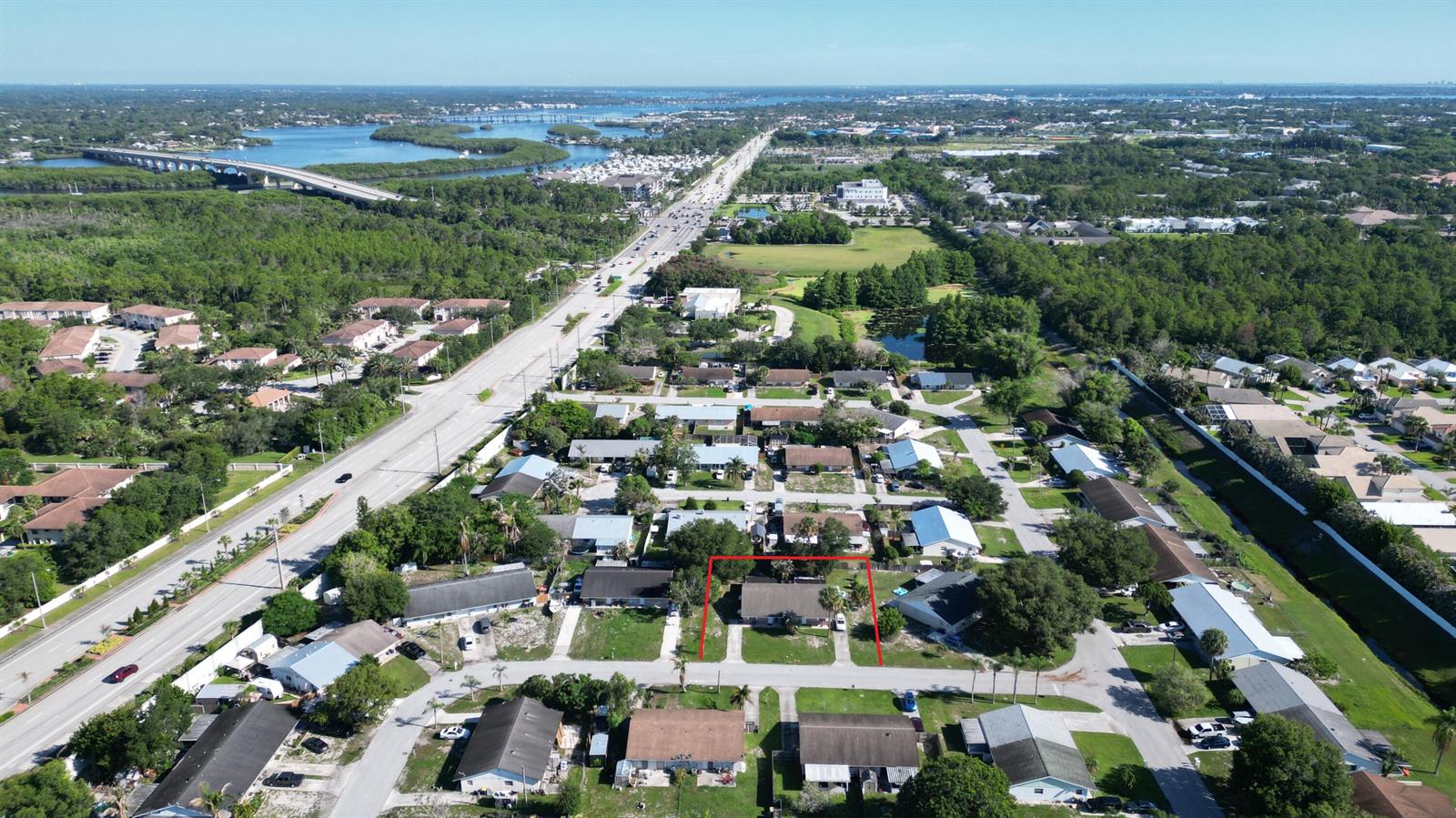An aerial view shows a residential neighborhood with a red-outlined single-story house — 85 & 95 SE Millwood Terrace, Stuart FL 34997, STUART, FL