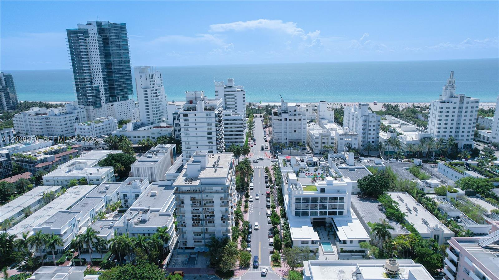An aerial view shows a city street leading toward the ocean with surrounding high-rise buildings — 245 18th St # 605, Miami Beach FL 33139, MIAMI BEACH, FL
