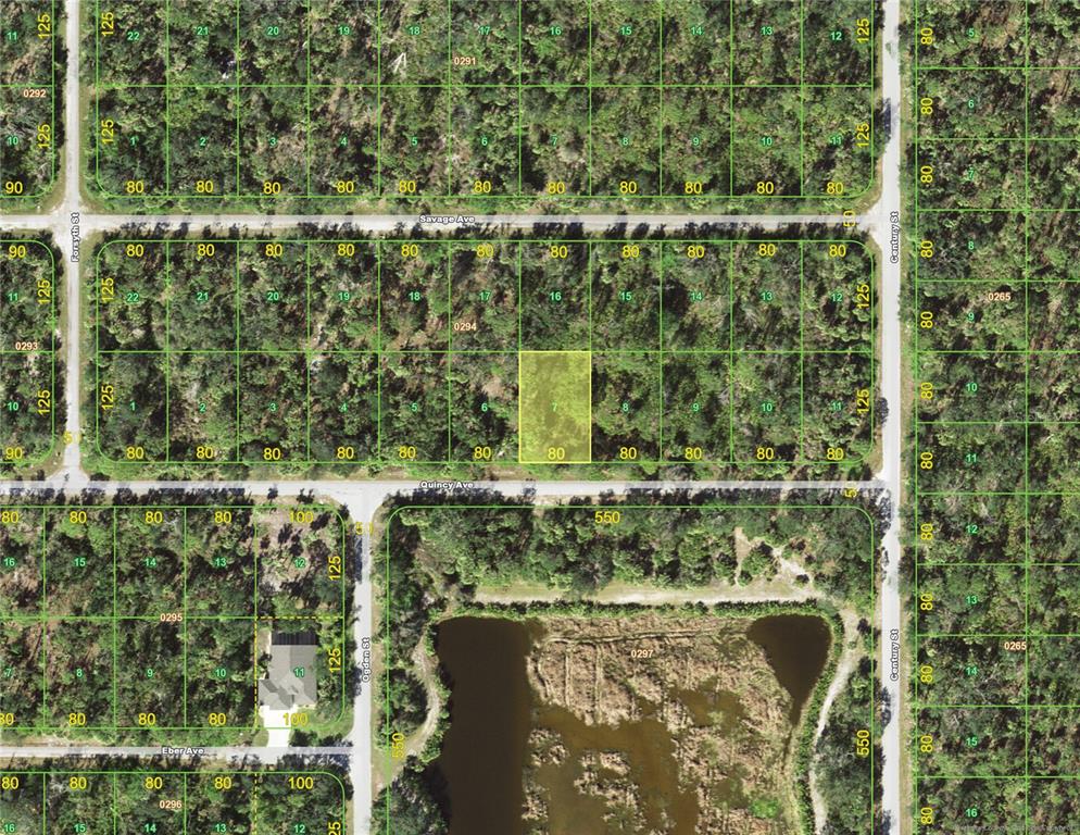This is a satellite map showing a highlighted rectangular land parcel among wooded residential lots — 18174 QUINCY (LOT 7) AVENUE, PORT CHARLOTTE, FL