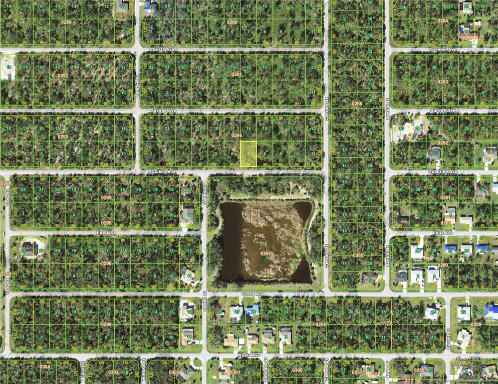 This is a satellite map showing a grid of residential lots and a central pond — 18174 QUINCY (LOT 7) AVENUE, PORT CHARLOTTE, FL