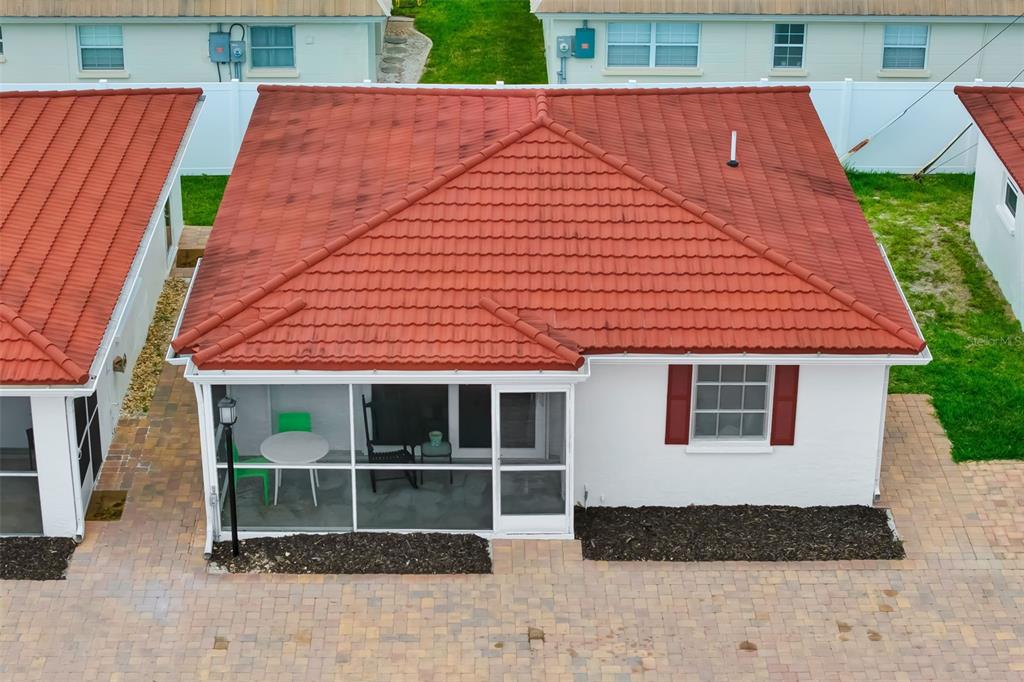 An aerial view shows a house with a red tile roof and a screened-in patio — 6154 MIDNIGHT PASS ROAD UNIT A-3, SARASOTA, FL