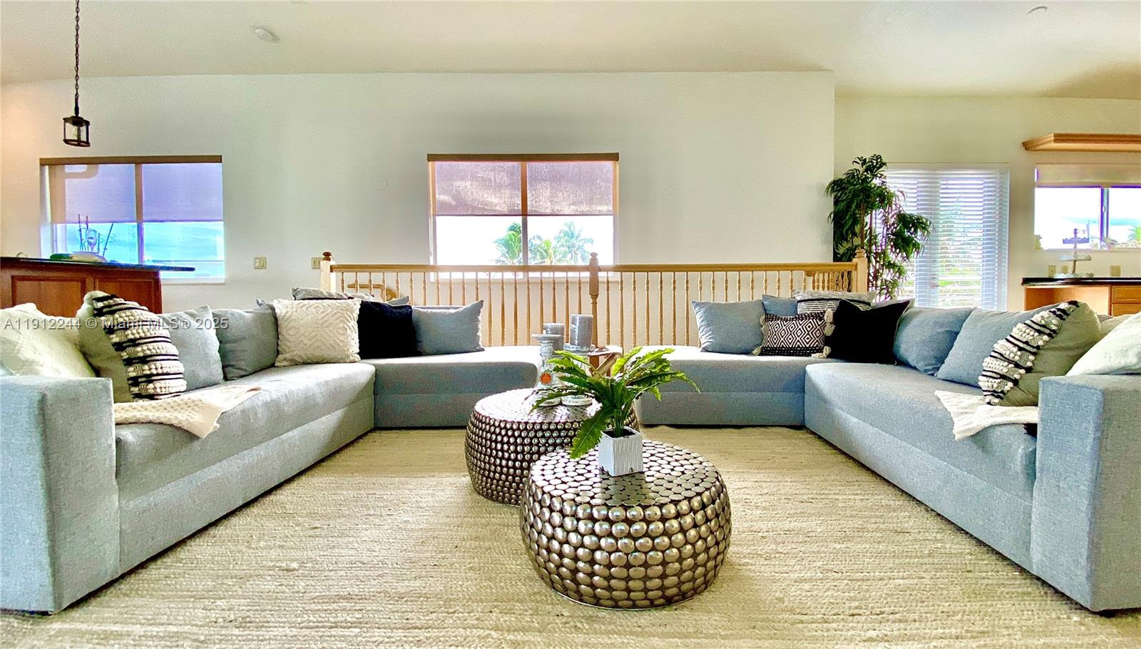 A living room features a large sectional sofa, two metallic coffee tables, and light flooring — 302 Balboa St # 0, Hollywood FL 33019, HOLLYWOOD, FL