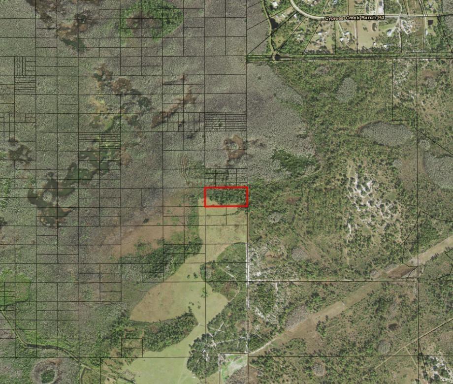 This aerial map shows a rectangular property highlighted in red amidst a rural landscape — 0 Holopaw Groves Road, FL 34772, FL
