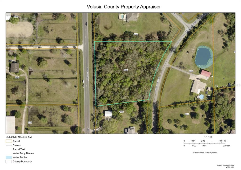 This is a property map showing a parcel of land outlined in blue — 1903 SPRUCE CREEK CIRCLE, PORT ORANGE, FL