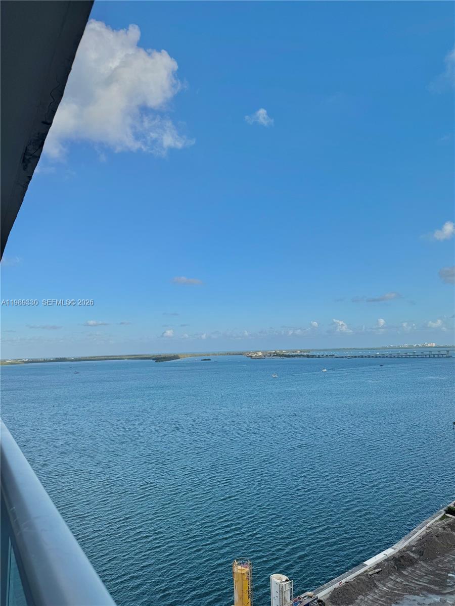 An elevated view shows a large body of water under a clear blue sky — 1155 Brickell Bay Dr # 1705, Miami FL 33131, MIAMI, FL