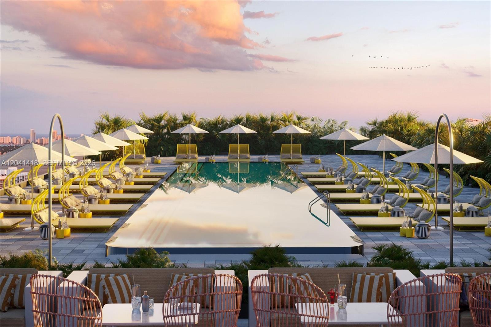 This rendering shows a rooftop swimming pool surrounded by lounge chairs and umbrellas at sunset — 90 NE 32nd St # 707, Miami FL 33137, MIAMI, FL
