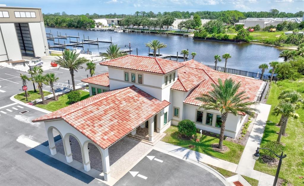An aerial view of a building with a red tile roof and a covered entryway — 36 RIO VISTA DRIVE, PALM COAST, FL