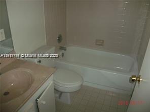 A bathroom features a vanity with a sink, a toilet, and a shower-tub combination — 1338 White Pine Dr, Wellington FL 33414, WELLINGTON, FL