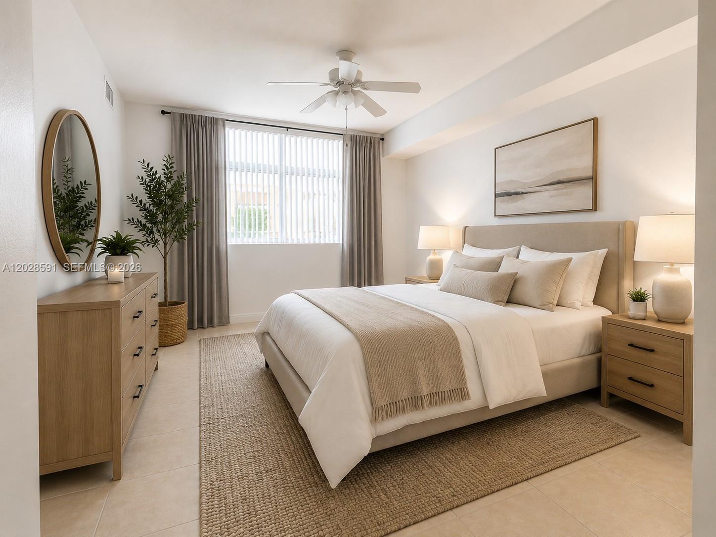 A bright bedroom features a neutral color palette, a queen bed, and light wood furniture — 140 S Dixie Hwy # 433, Hollywood FL 33020, HOLLYWOOD, FL