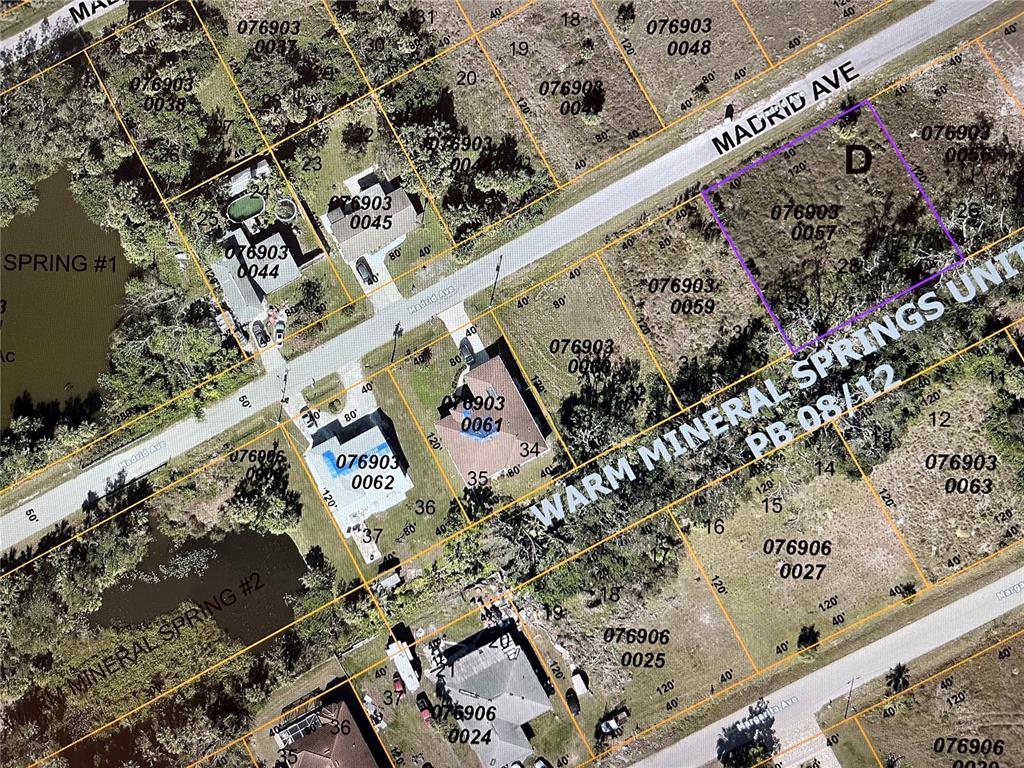 This is an aerial map showing residential lots, streets, and water features — LOT 27,28 &29 MADRID AVENUE, NORTH PORT, FL