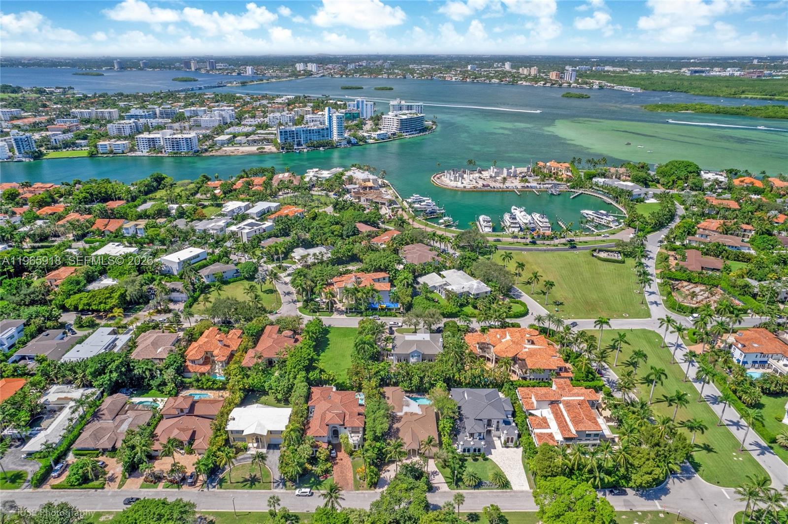 A single-story white house with a tiled roof and a large patterned concrete driveway — 52 Camden Dr, Bal Harbour FL 33154, BAL HARBOUR, FL