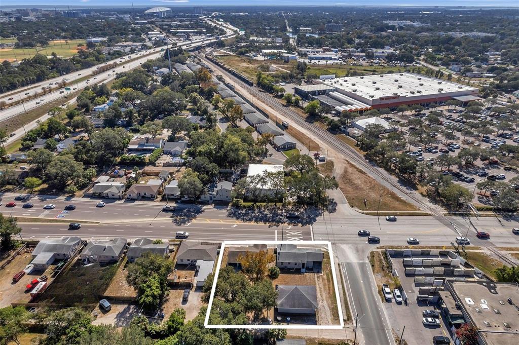 An aerial view shows a residential lot with three small buildings and mature trees — 2169 & 2179 22ND AVENUE N, ST PETERSBURG, FL