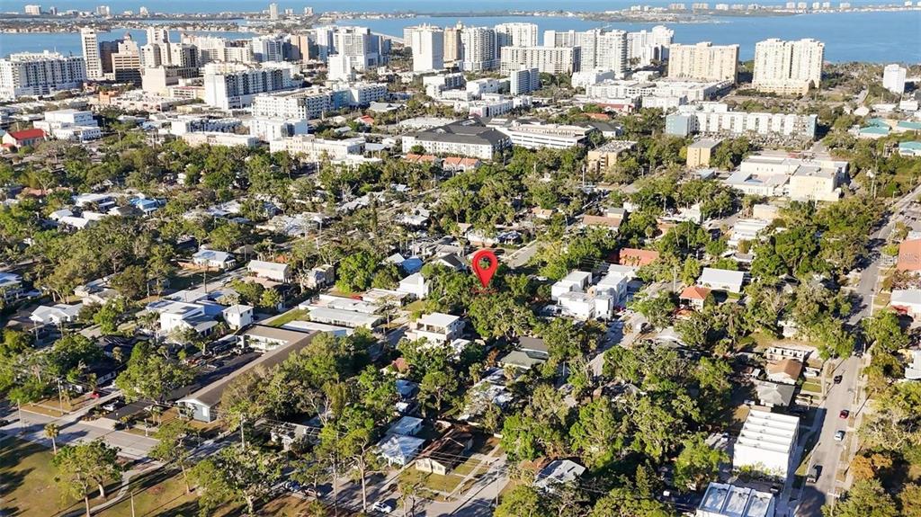 An aerial view shows a residential neighborhood with a red location pin marking a property — 1721 8TH STREET, SARASOTA, FL