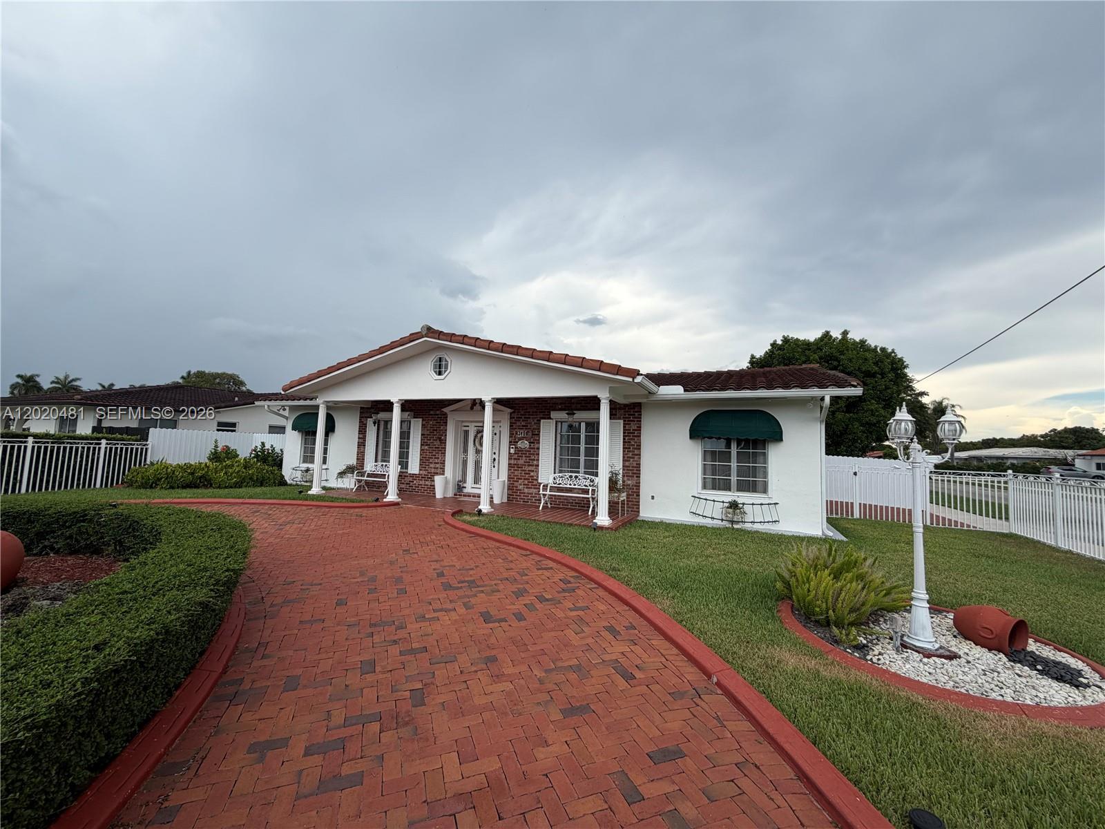 A single-story house with a brick driveway, white columns, and a red tile roof — 3400 SW 108th Ave, Miami FL 33165, MIAMI, FL