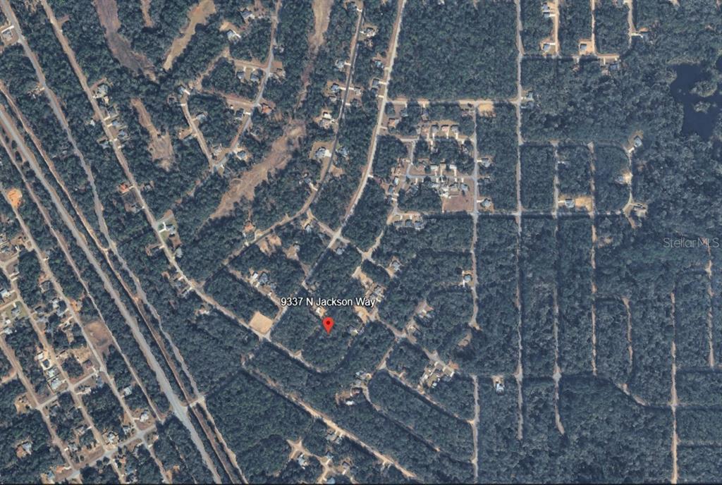 This is an aerial map view showing a residential property surrounded by wooded lots — 9337 N JACKSON WAY, CITRUS SPRINGS, FL