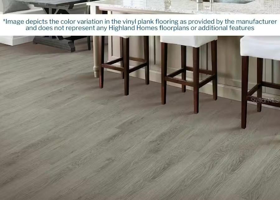 This image shows a kitchen area featuring light gray wood-look vinyl plank flooring — 4035 KINDLING WOOD WAY, ST CLOUD, FL
