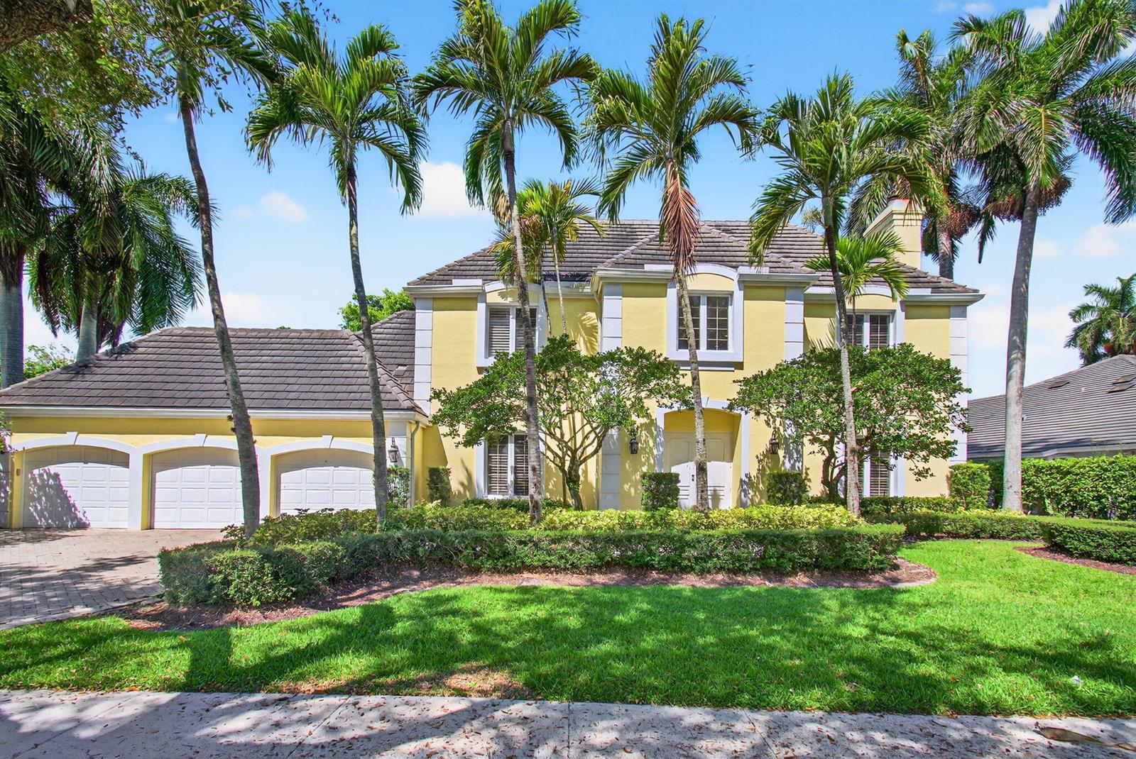 A two-story yellow house with a three-car garage and palm trees in the front yard — 6167 NW 23rd Way, Boca Raton FL 33496, BOCA RATON, FL