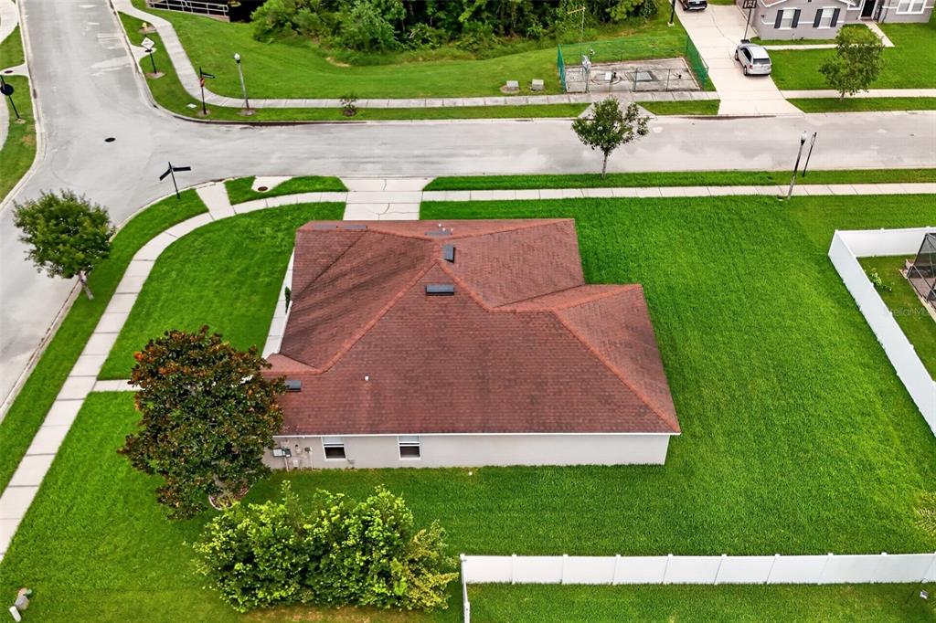 An aerial view shows a single-story house with a brown roof on a corner lot — 356 BLACK SPRINGS LANE, WINTER GARDEN, FL