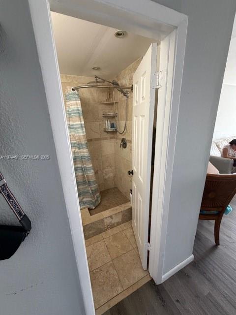 A tiled walk-in shower with a glass-free opening is visible through an open white door — 9390 W Flagler St # 206C, Miami FL 33174, MIAMI, FL