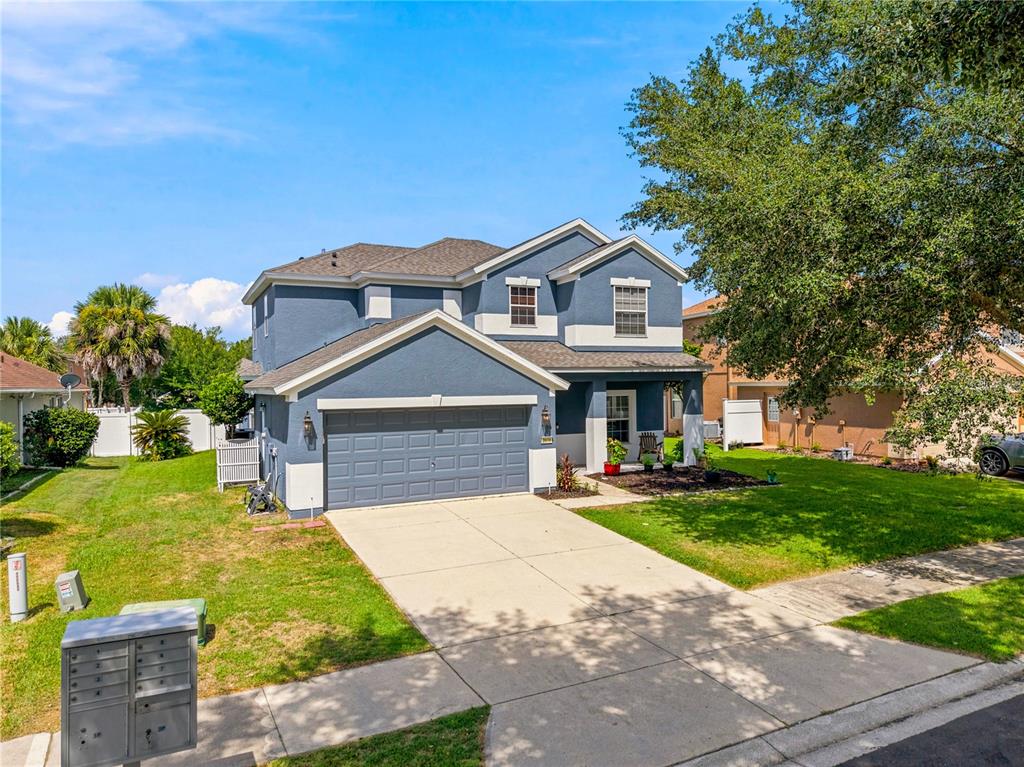 A two-story blue house with a two-car garage and a front lawn — 3970 SW 51ST TERRACE, OCALA, FL