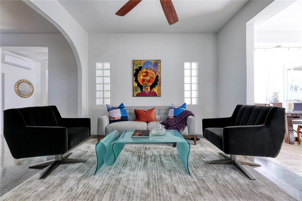 An entryway with terrazzo floors, a wooden double door, a ceiling fan, and abstract art — 3 PACIFIC PLACE STREET, SAN JUAN, PR